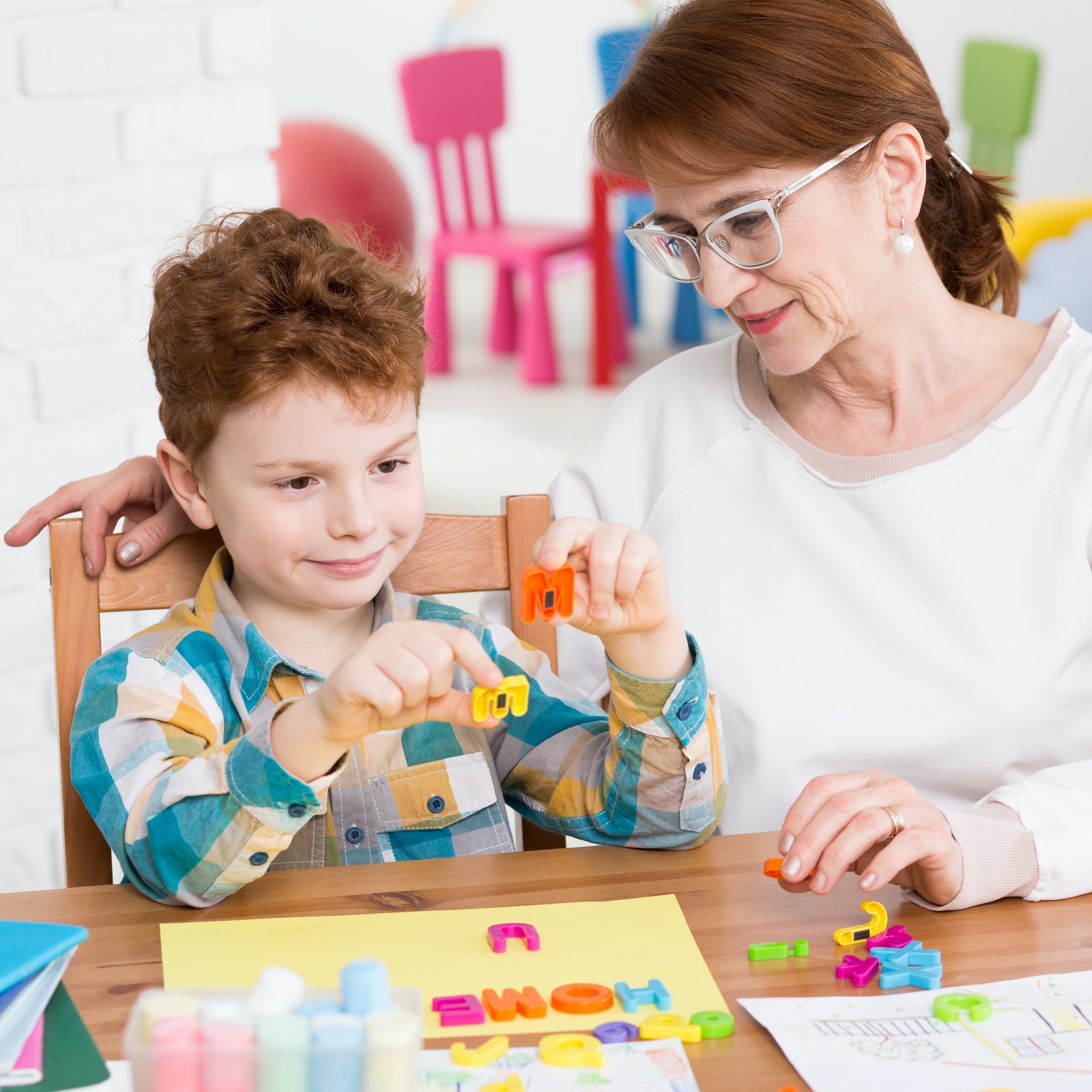 child engaged in block building activity during pediatric developmental therapy session